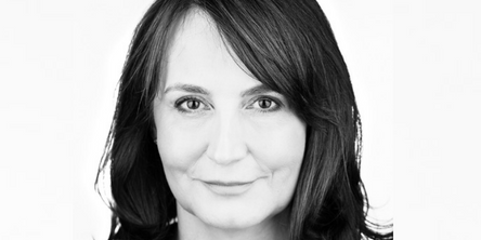Black and white portrait of a woman with shoulder-length hair.
