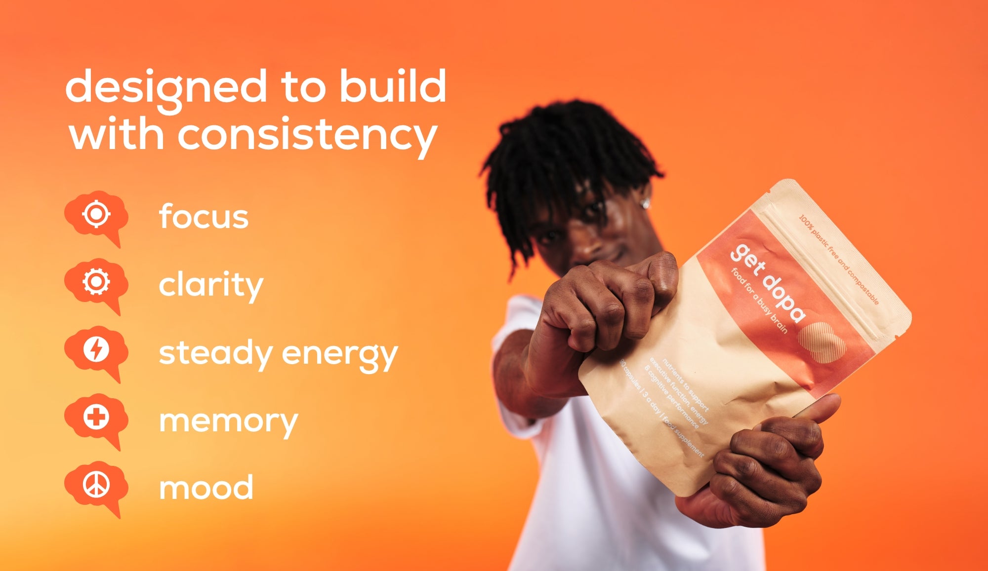 Person holding a container with text about consistency and get dopa benefits on an orange background