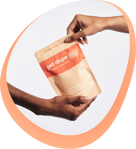 Two hands holding get dopa pouch